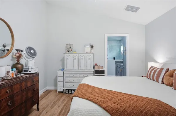 a bed room with a bed and a lamp