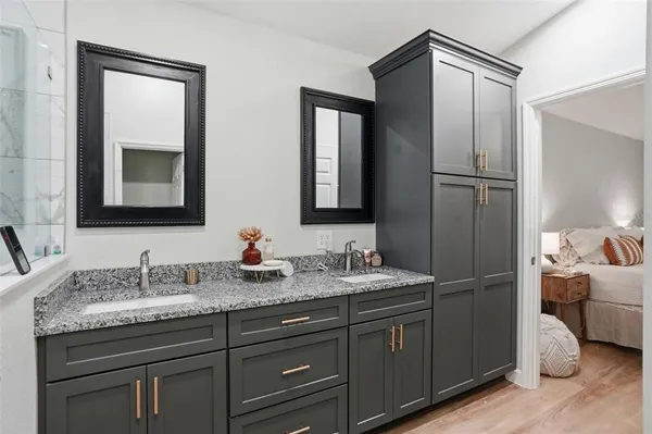 a bathroom with a sink and mirror