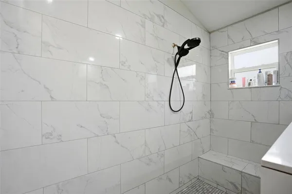 a bedroom with a bed and a rug