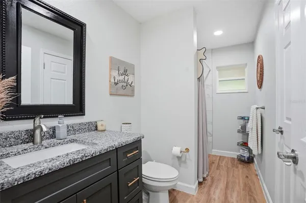 a view of a chairs in backyard of a house