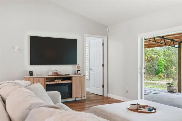 a kitchen with stainless steel appliances granite countertop a sink refrigerator and cabinets