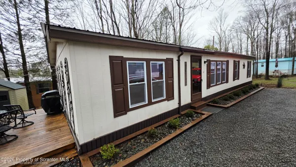 a view of a house with backyard