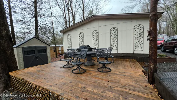 a view of a dinning table and chairs in patio