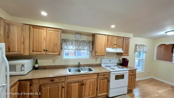 a kitchen with a stove and a sink