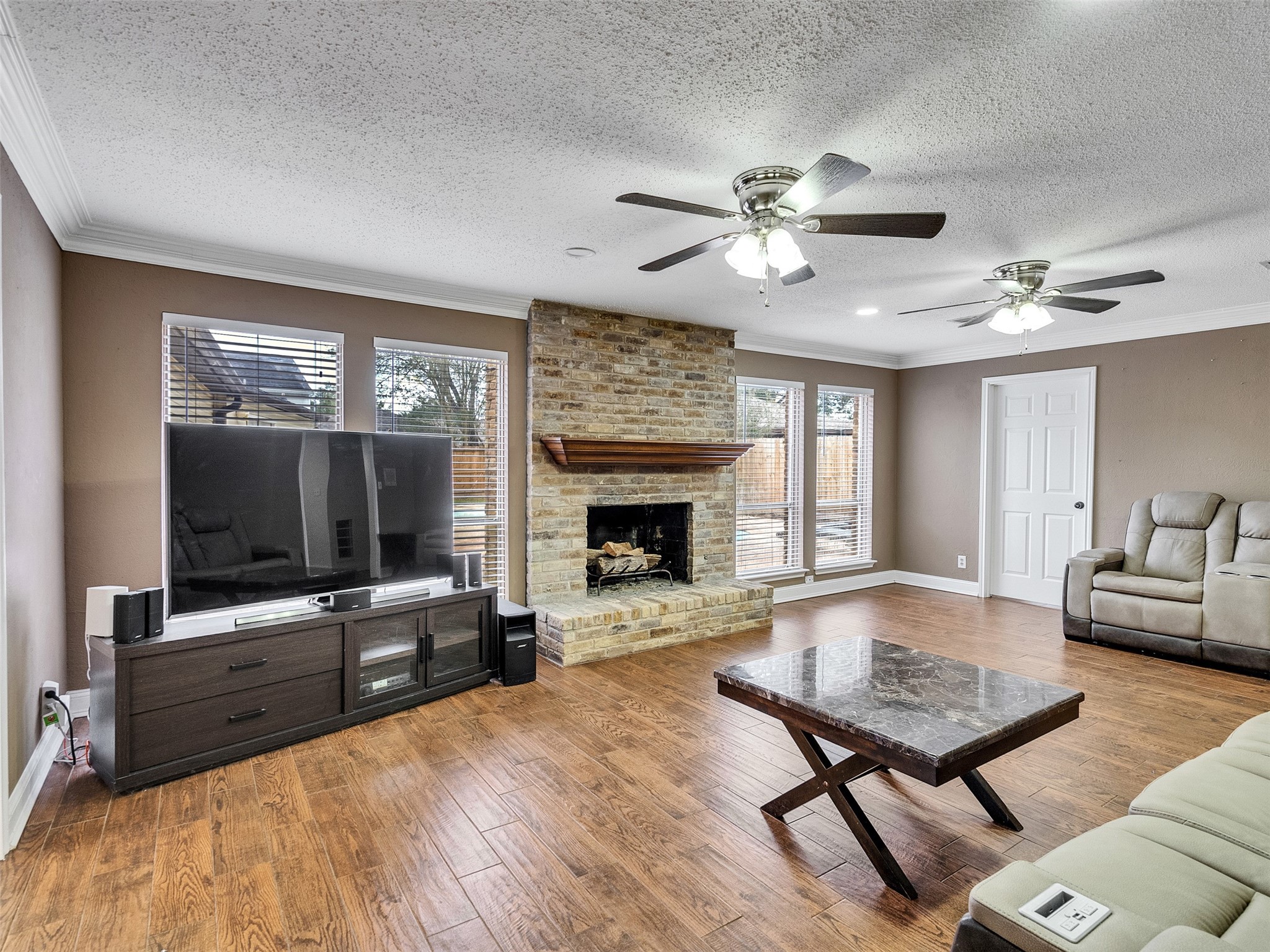 15703 Crestbrook Drive Houston, TX 77059 - Photo 23 of 50 To the right of fireplace is the primary bedroom.