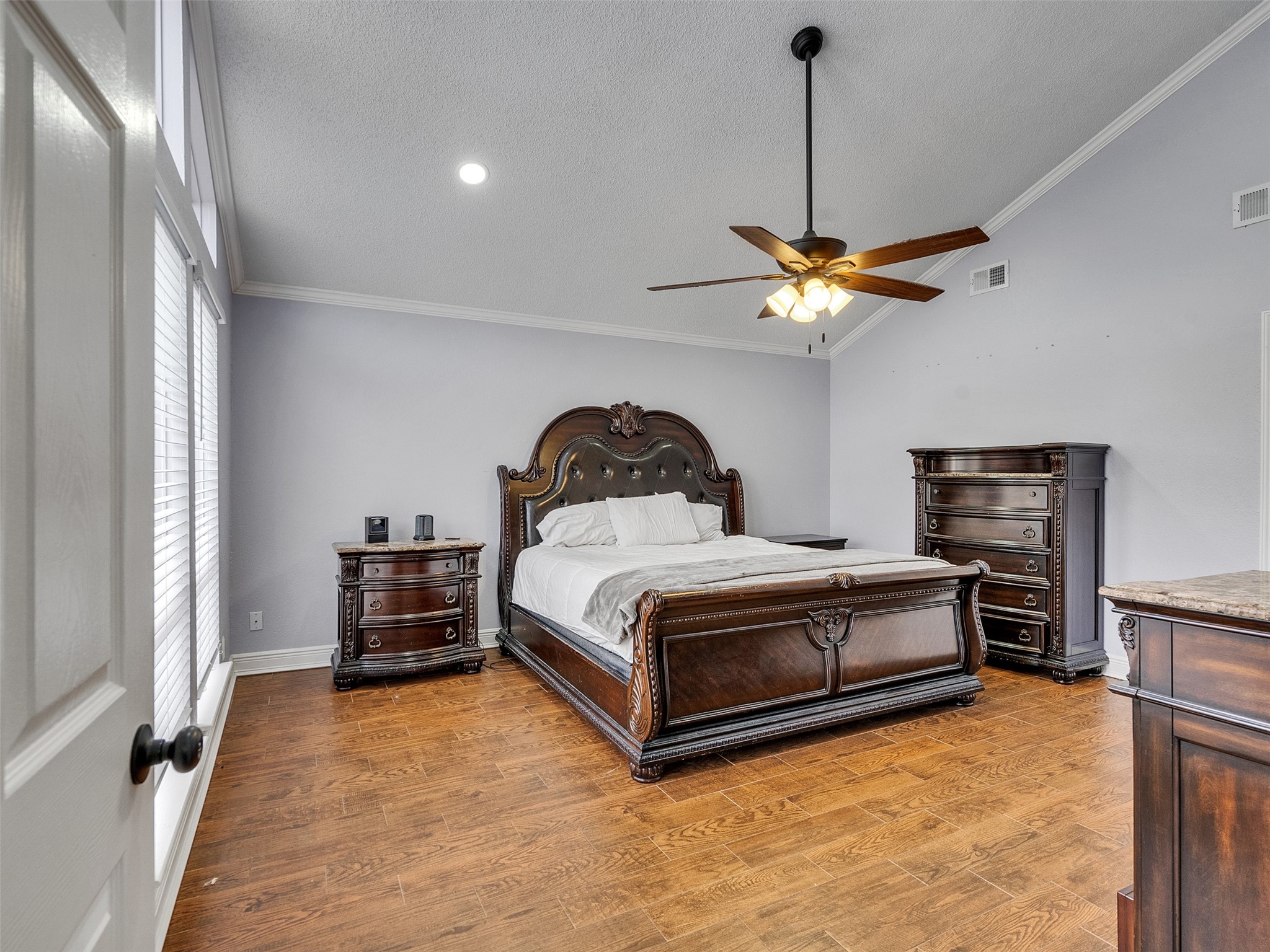 15703 Crestbrook Drive Houston, TX 77059 - Photo 25 of 50 Very large Primary bedroom downstairs with floor to ceiling windows looking to backyard oasis.