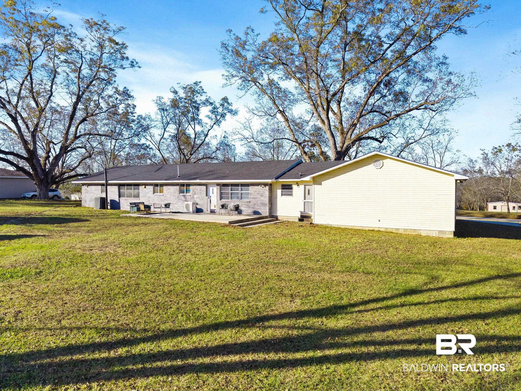 21267 Loop Road Andalusia, AL 36421 - Photo 69 of 72 Back of property with a yard, a patio, and crawl space