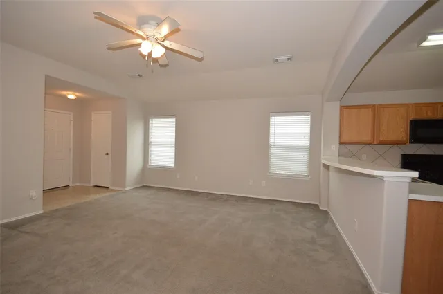 a view of an empty room with a window