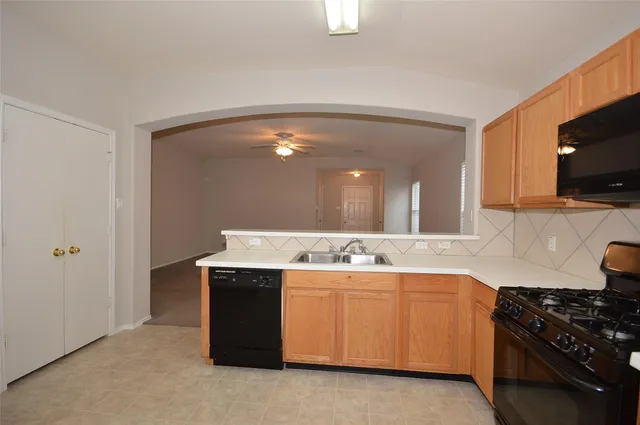 a kitchen with a stove and a microwave