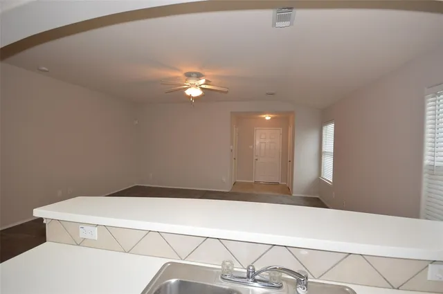 a bedroom with a bed and chandelier