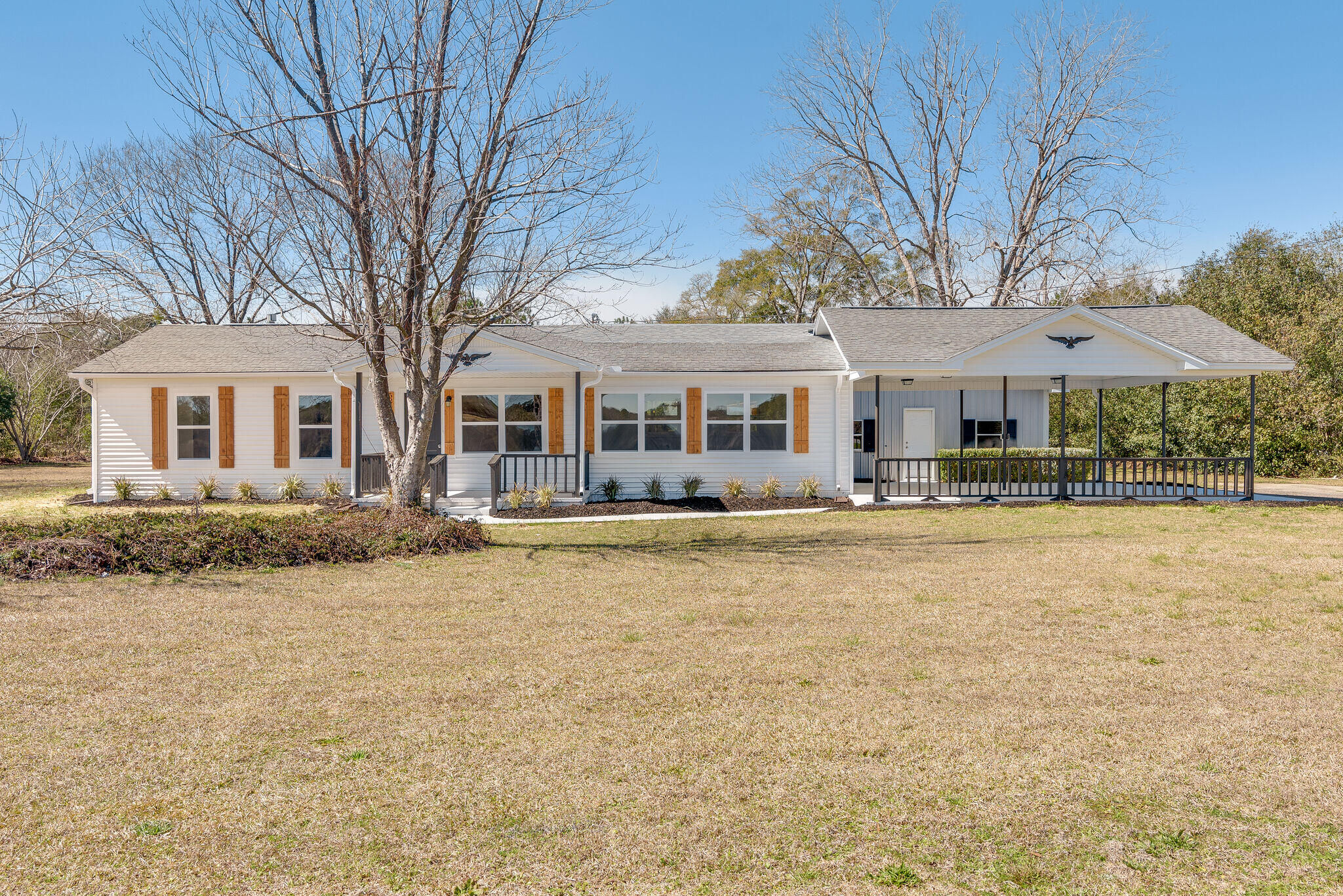 5238 Griffith Mill Road Baker, FL 32531 - Photo 1 of 34 a front view of a house with a yard table and chairs