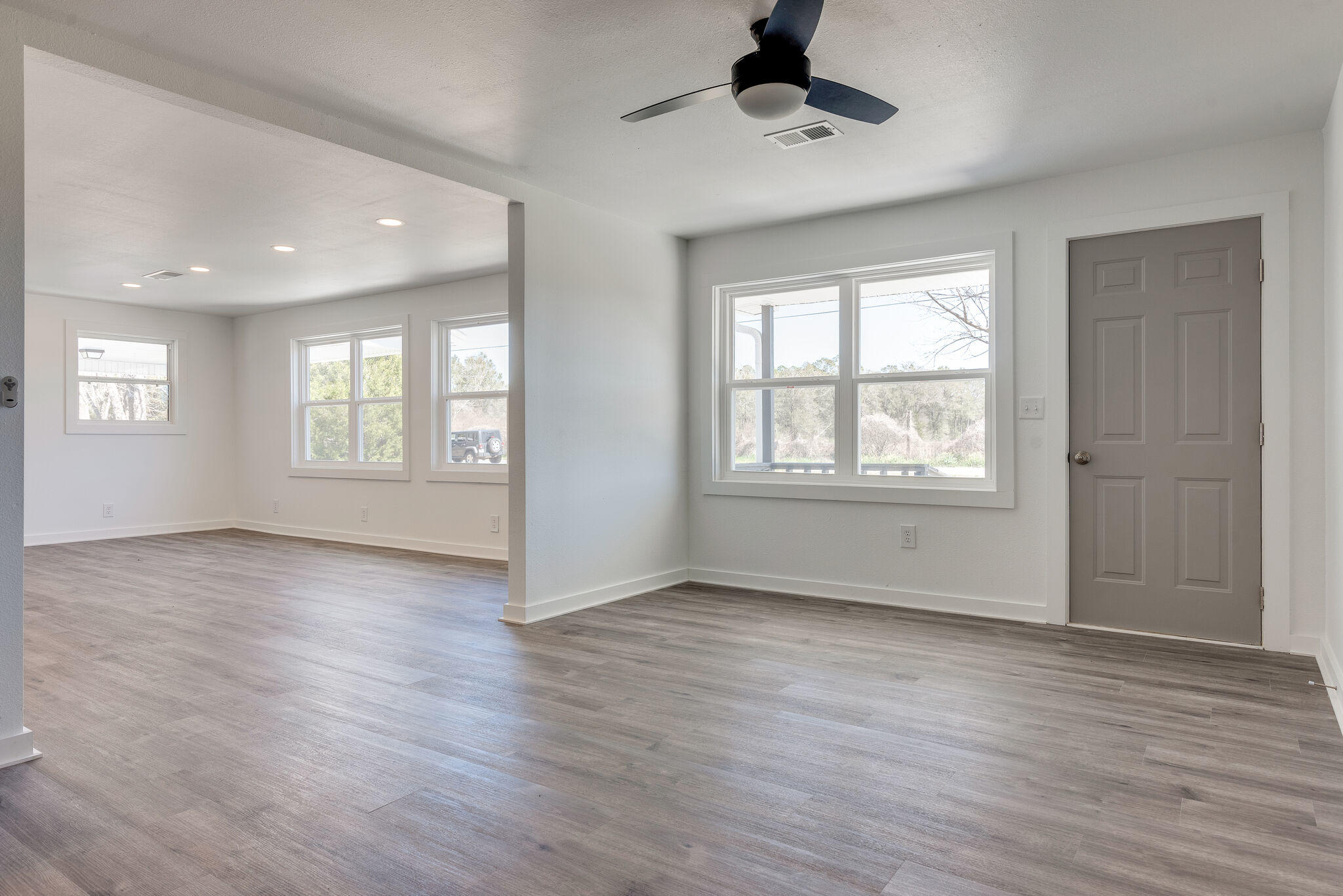 5238 Griffith Mill Road Baker, FL 32531 - Photo 9 of 34 a view of an empty room with window and wooden floor