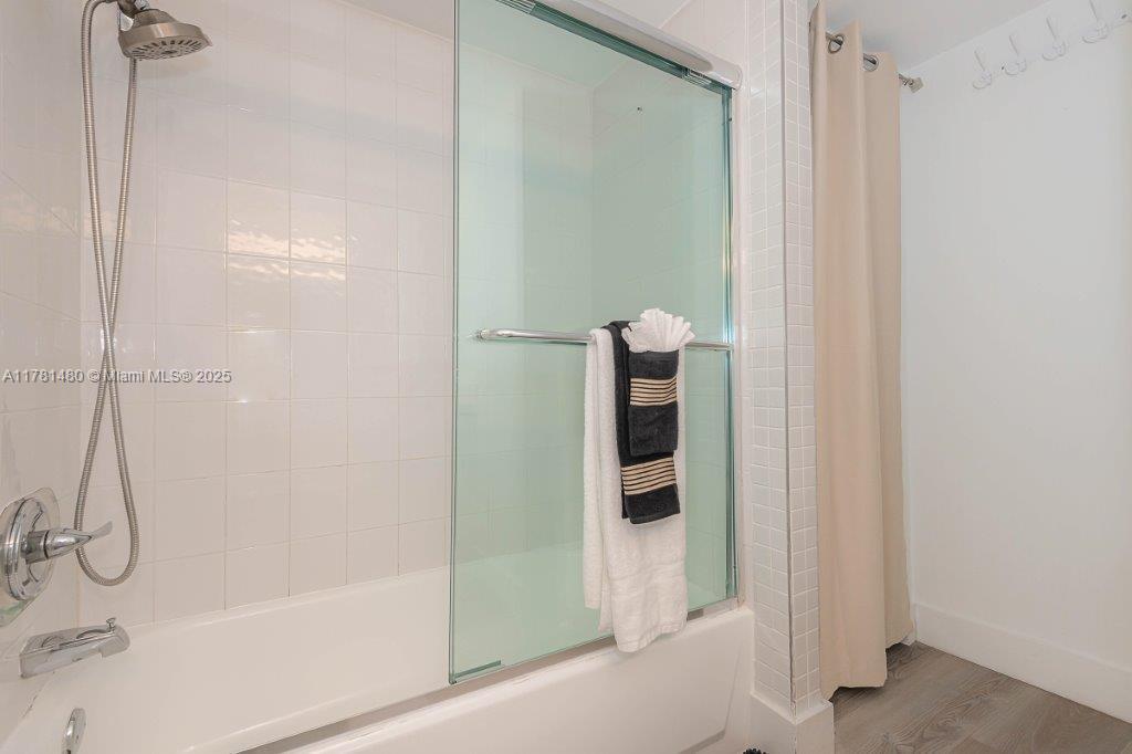 2301 Collins Avenue, Unit 401 Miami Beach, FL 33139 - Photo 6 of 38 a bathroom with a shower