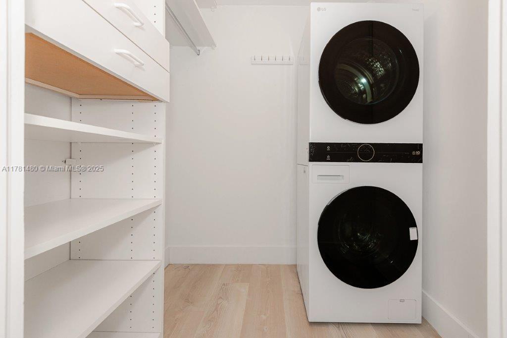 2301 Collins Avenue, Unit 401 Miami Beach, FL 33139 - Photo 7 of 38 a close up view of a washer and dryer