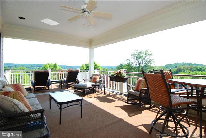 2121 Gadd Road Cockeysville, MD 21030 - Photo 23 of 28 a outdoor space with patio the couches and a dining table with garden view