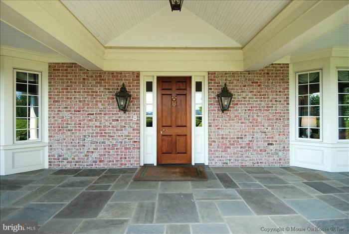 2121 Gadd Road Cockeysville, MD 21030 - Photo 4 of 28 front view of a brick house with a door
