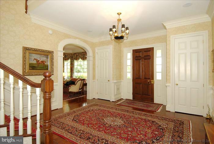 2121 Gadd Road Cockeysville, MD 21030 - Photo 6 of 28 a bedroom with a bed and a chandelier