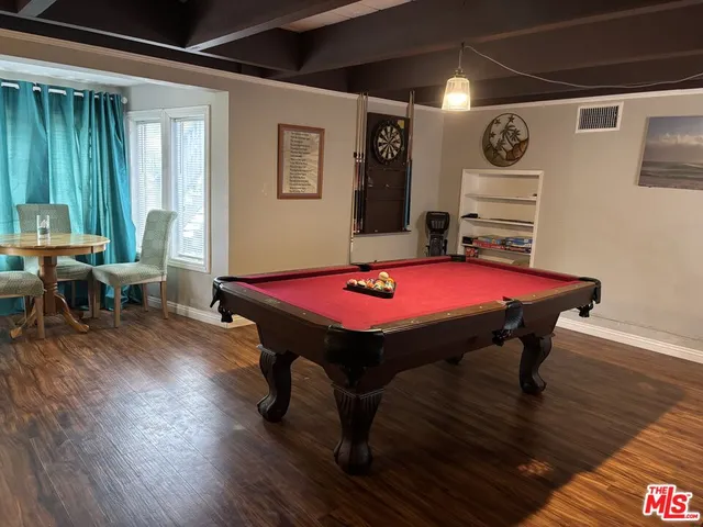 a room with furniture and wooden floor