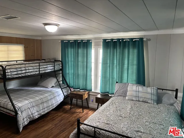 a bedroom with furniture and a window