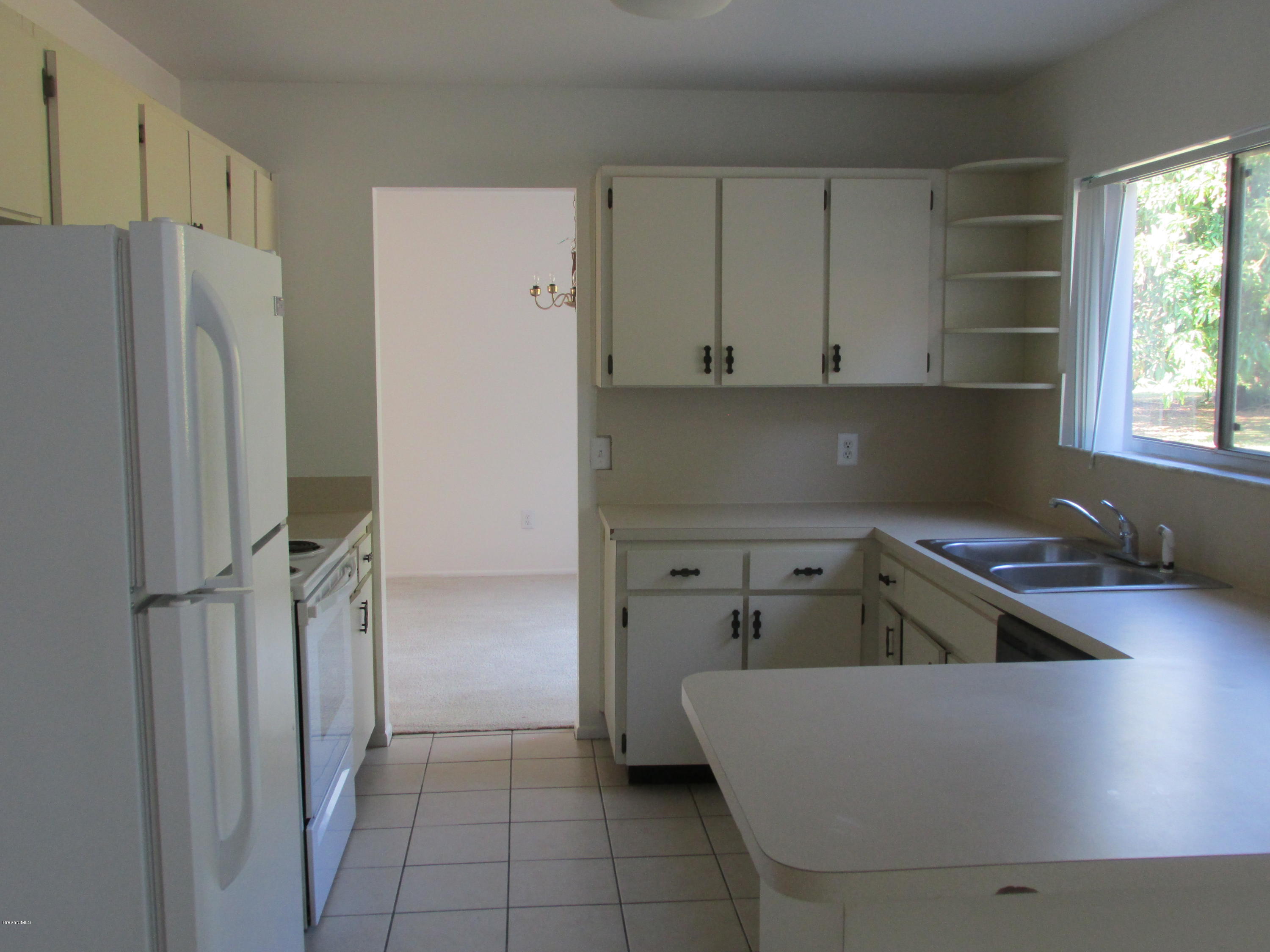 991 Hooper Avenue Northeast Palm Bay, FL 32905 - Photo 3 of 13 IMG_1210