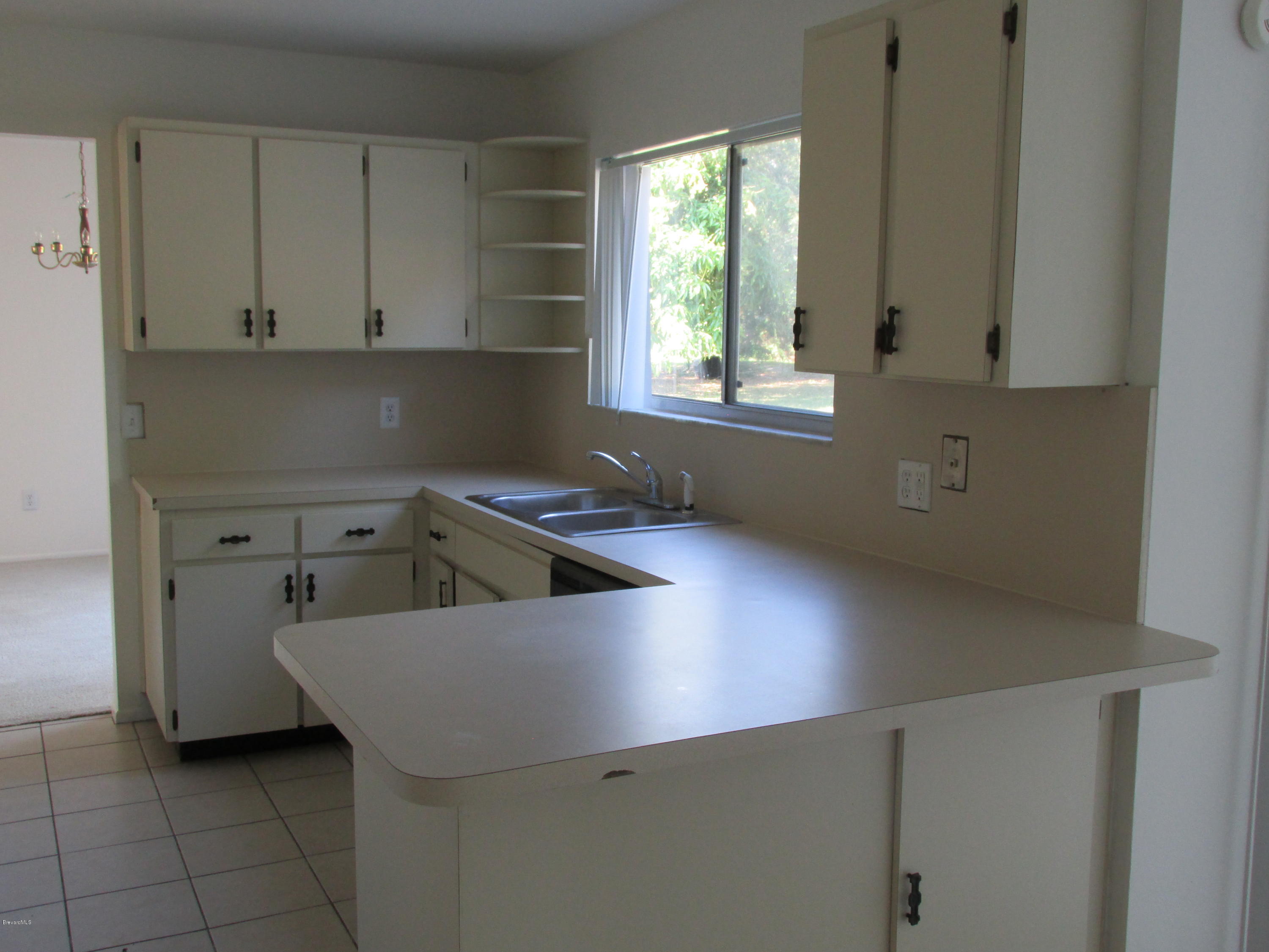 991 Hooper Avenue Northeast Palm Bay, FL 32905 - Photo 4 of 13 IMG_1211