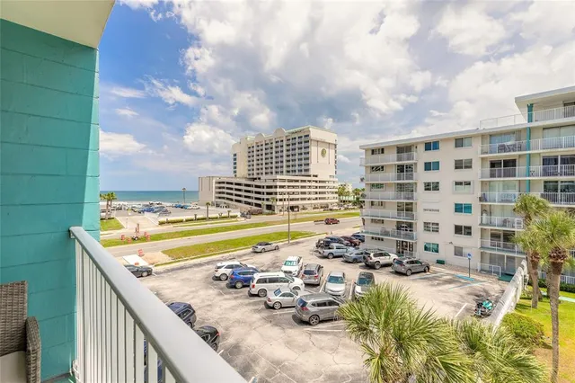 a view of swimming pool with a balcony