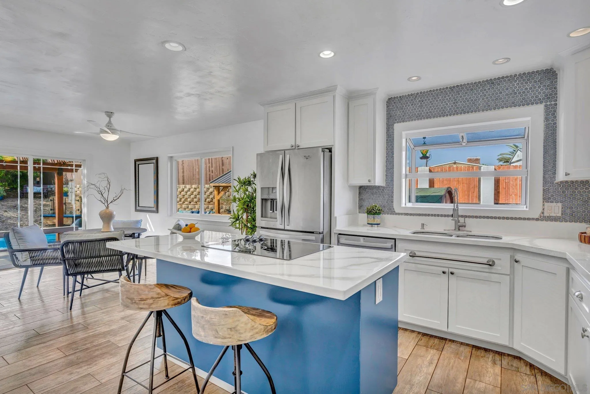 1217 Memory Lane Vista, CA 92084 - Photo 11 of 72 a kitchen with stainless steel appliances granite countertop a kitchen island a stove and a sink