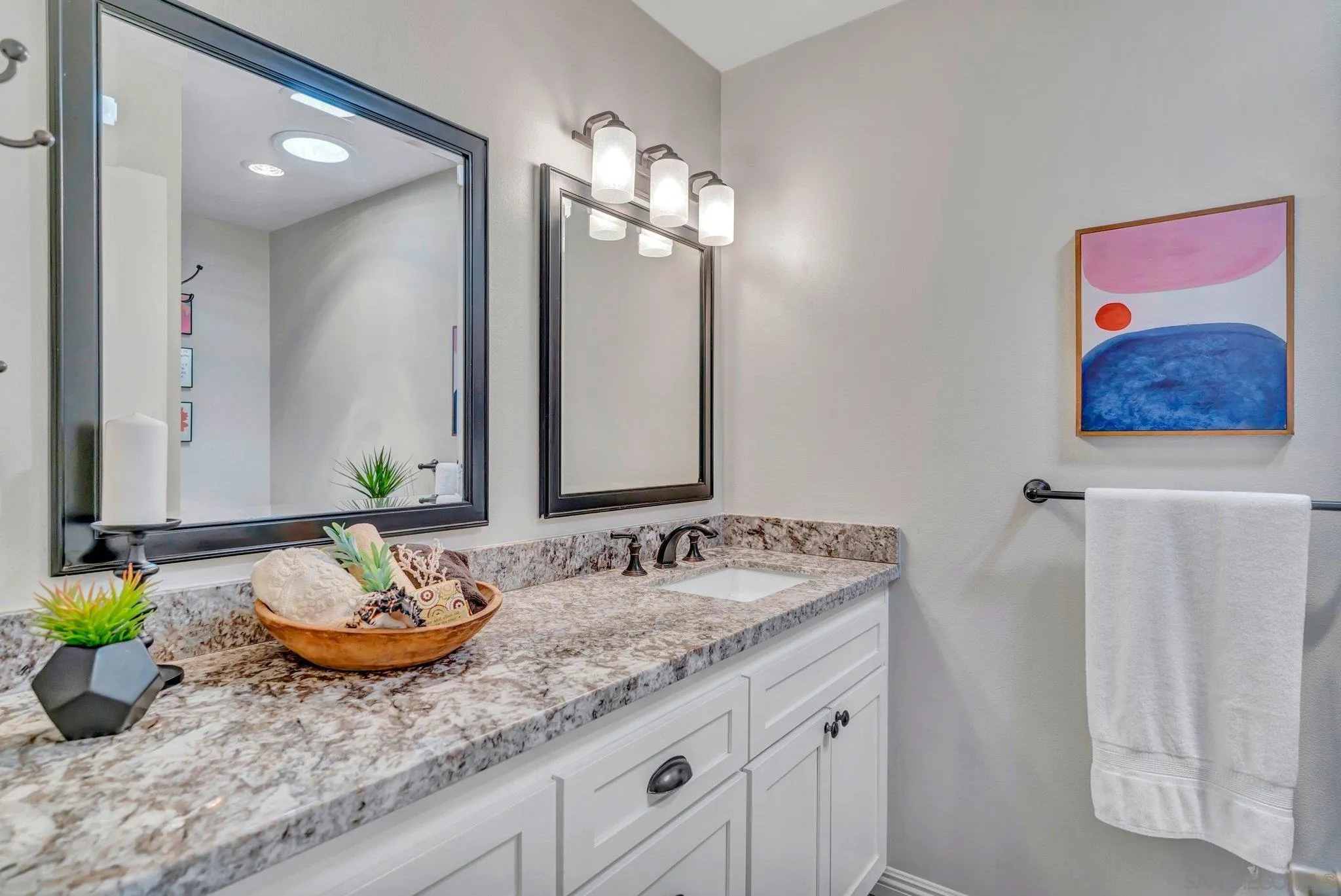 1217 Memory Lane Vista, CA 92084 - Photo 18 of 72 a bathroom with a granite countertop sink and a mirror
