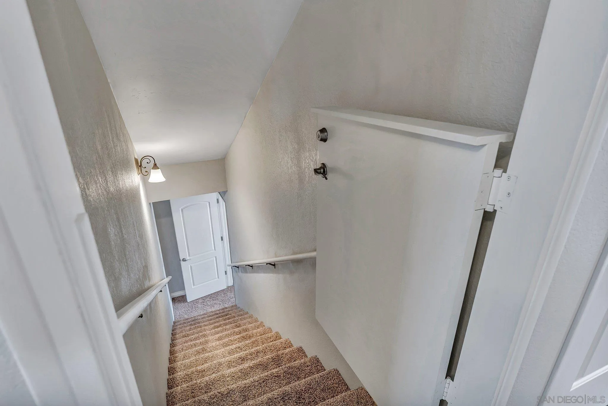 1217 Memory Lane Vista, CA 92084 - Photo 20 of 72 a view of a hallway with wooden floor and staircase
