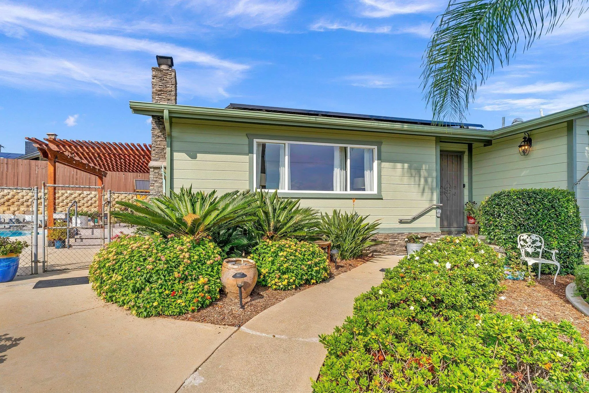 1217 Memory Lane Vista, CA 92084 - Photo 55 of 72 a front view of a house with a garden