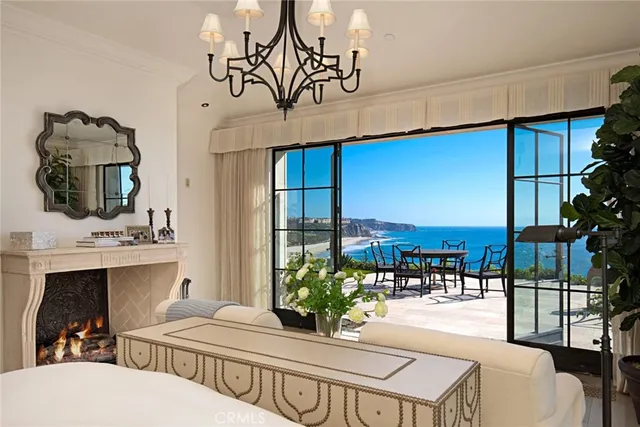 a dining room with furniture and a floor to ceiling window