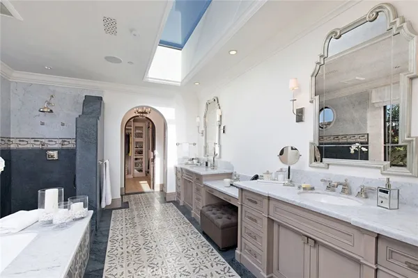 a spacious bathroom with a double vanity sink double and mirror