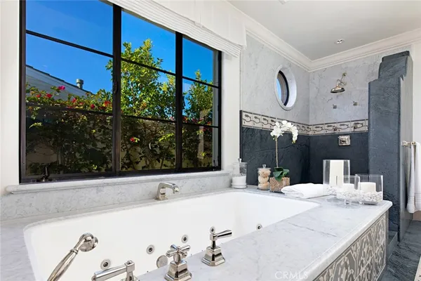 a bathroom with a tub and sink