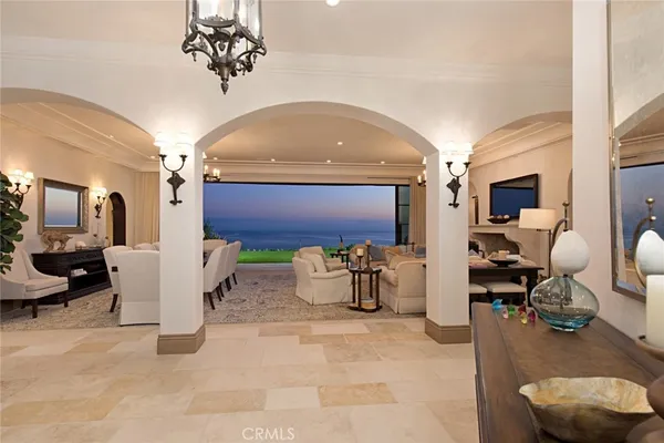 a view of a livingroom with furniture and a chandelier