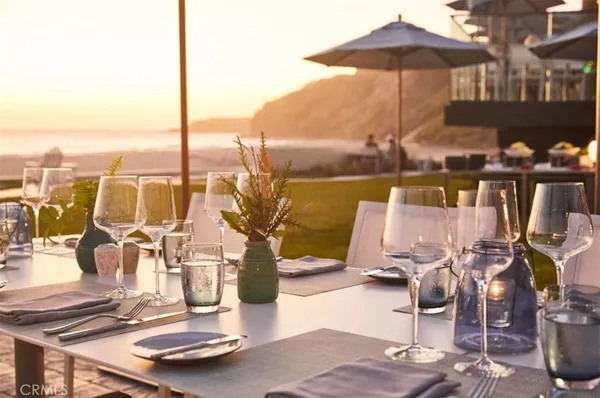 a very nice looking living room with furniture and floor to ceiling windows