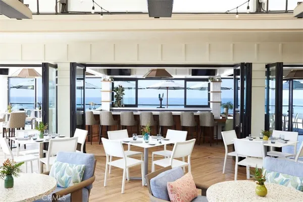 a view of an outdoor dining space with a table and chairs
