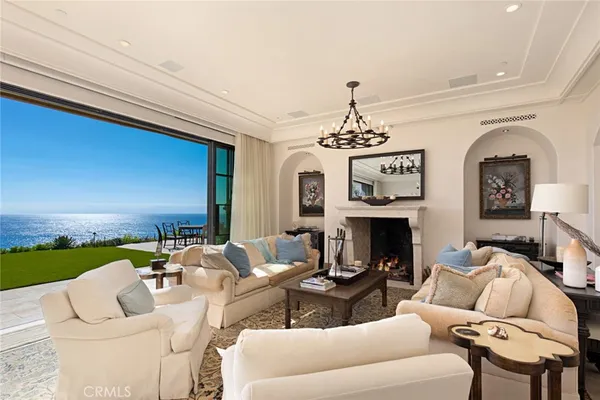 a living room with furniture a fireplace and a table