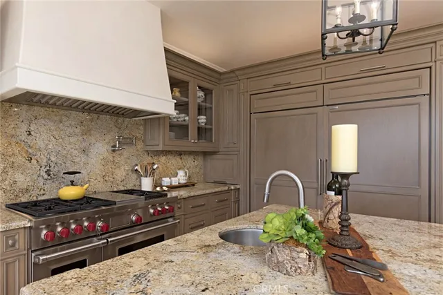 a kitchen with a stove and a dining table