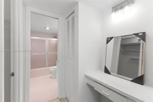 a bathroom with a shower and a sink