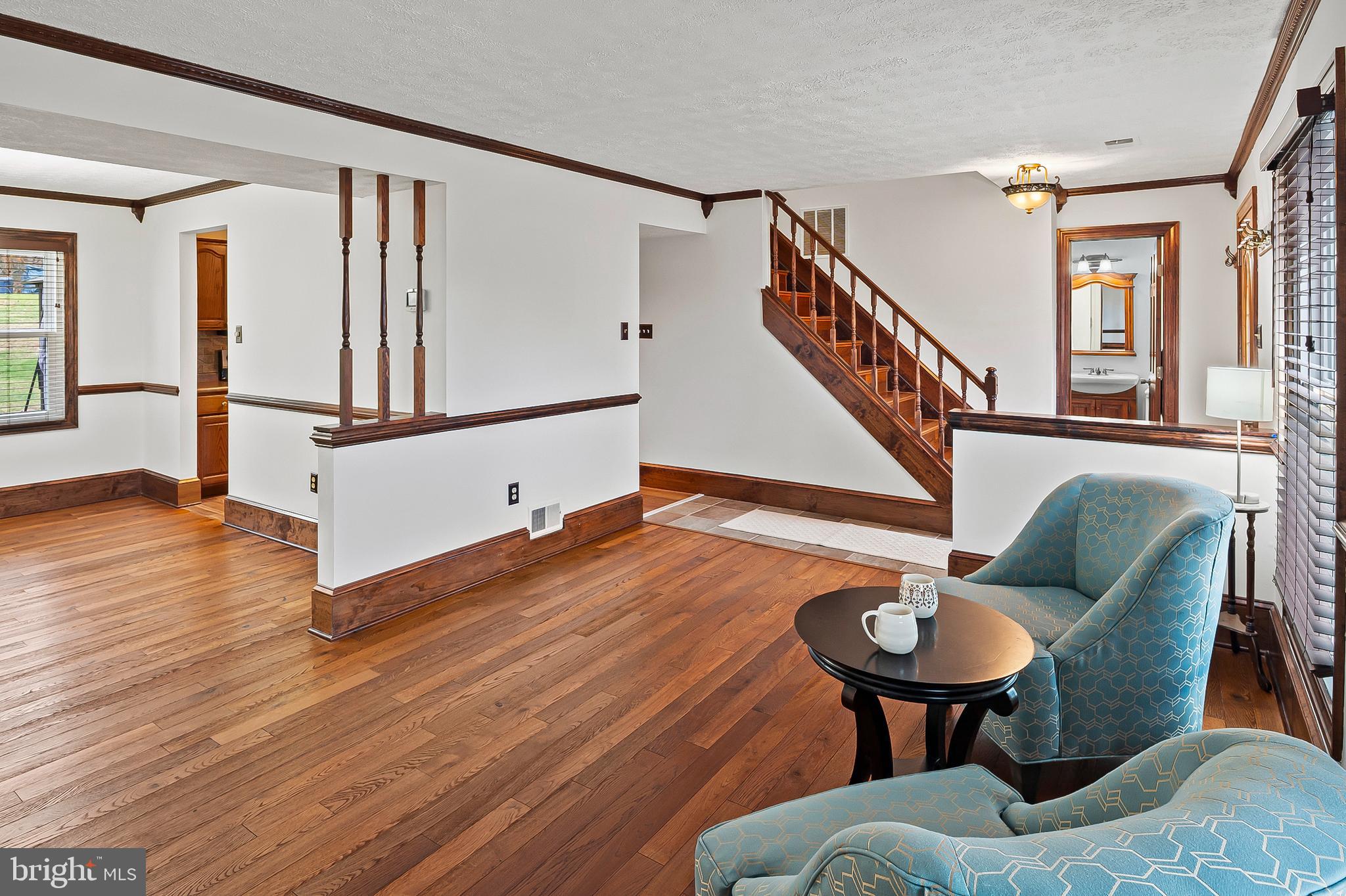 2472 Wintergreen Way Gambrills, MD 21054 - Photo 10 of 55 a living room with furniture and a dining table