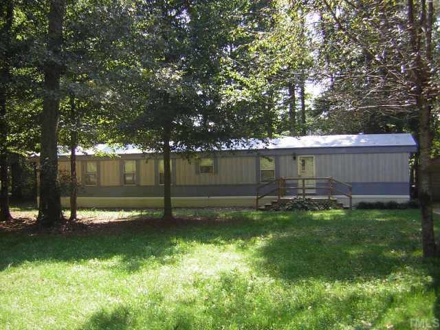 665 Saplin Branch Road Timberlake, NC 27583 - Photo 1 of 10 a view of a backyard with large trees