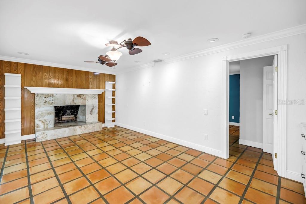 11174 90th Terrace Seminole, FL 33772 - Photo 12 of 35 a view of a livingroom with a fireplace and cabinet
