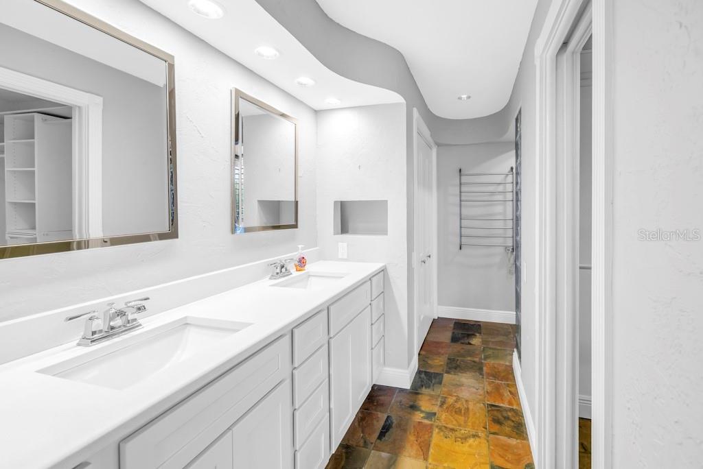 11174 90th Terrace Seminole, FL 33772 - Photo 21 of 35 a bathroom with a sink and a mirror