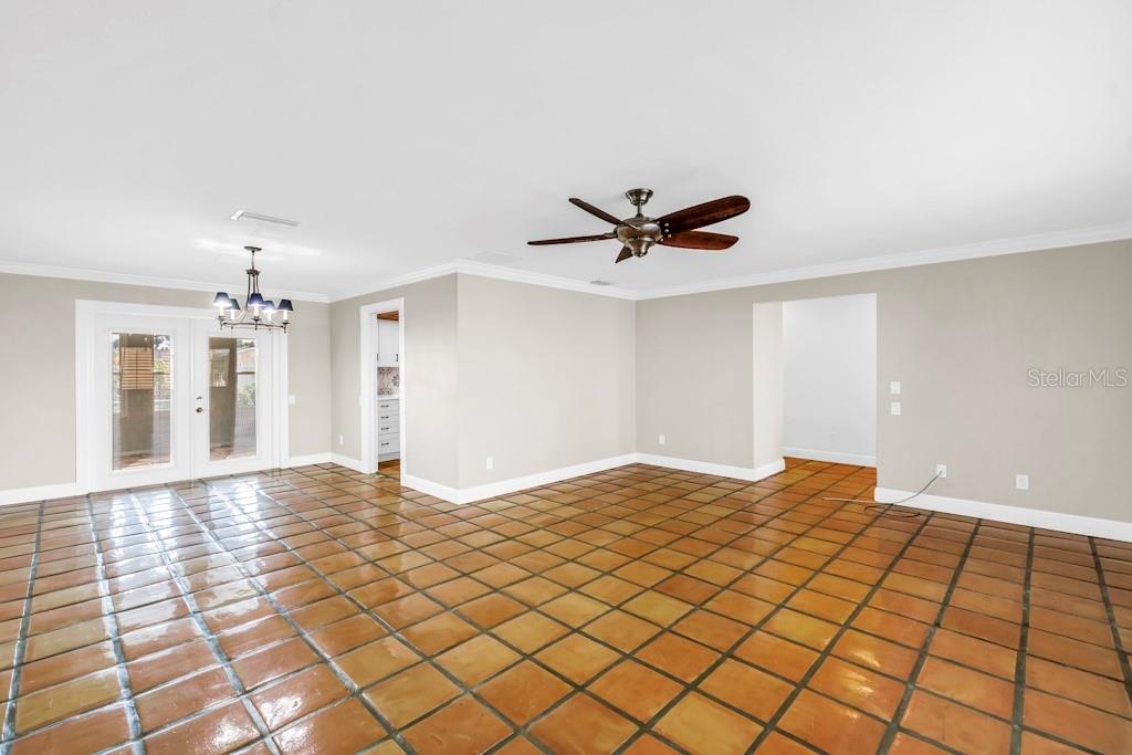 11174 90th Terrace Seminole, FL 33772 - Photo 8 of 35 a view of a livingroom with a chandelier fan and wooden floor