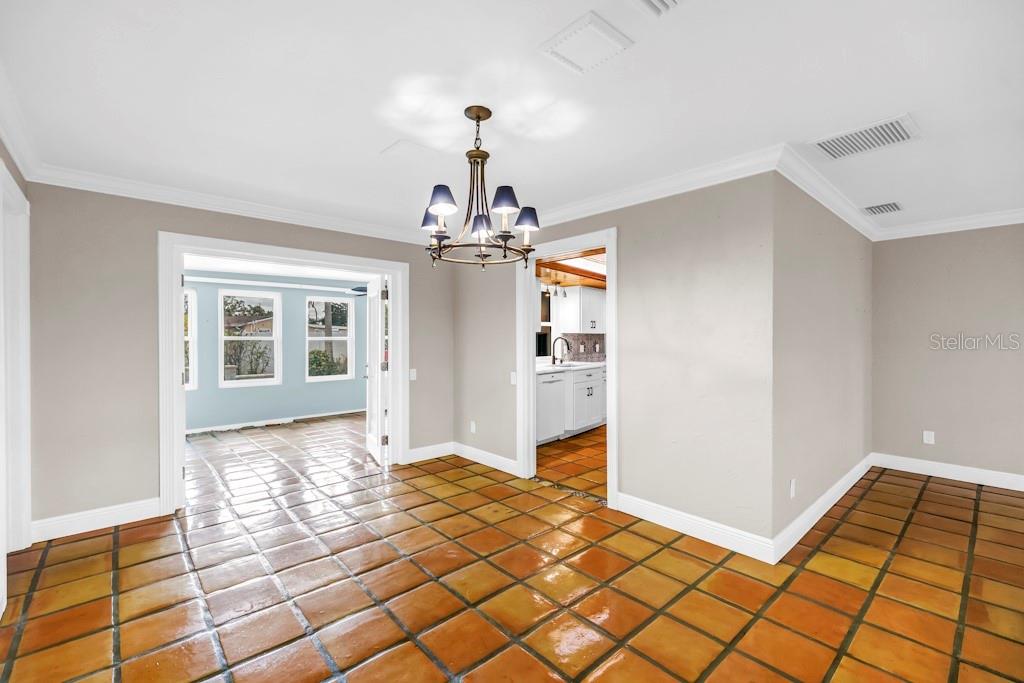 11174 90th Terrace Seminole, FL 33772 - Photo 10 of 35 a view of a hallway view with wooden floor and chandelier