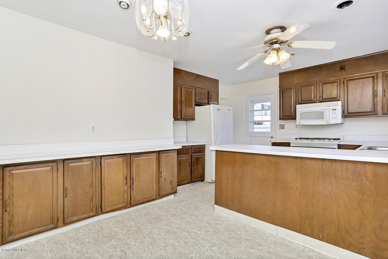6 Amherst Road Riverside, CT 06878 - Photo 11 of 22 a view of kitchen with granite countertop cabinets stainless steel appliances and a chandelier