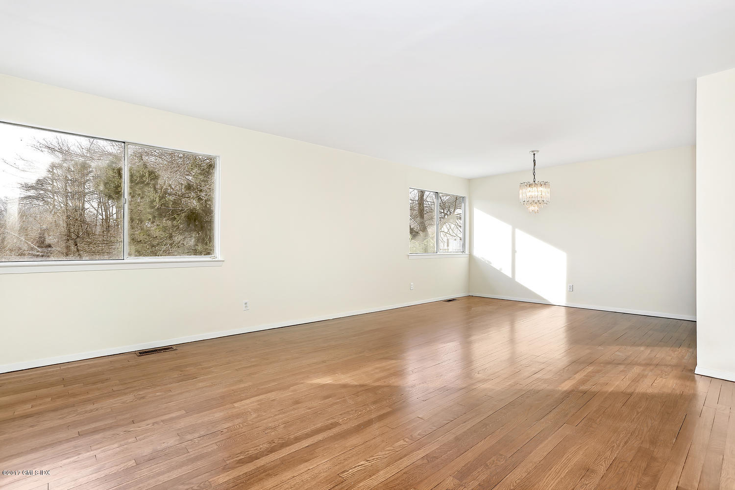 6 Amherst Road Riverside, CT 06878 - Photo 13 of 22 an empty room with wooden floor and windows