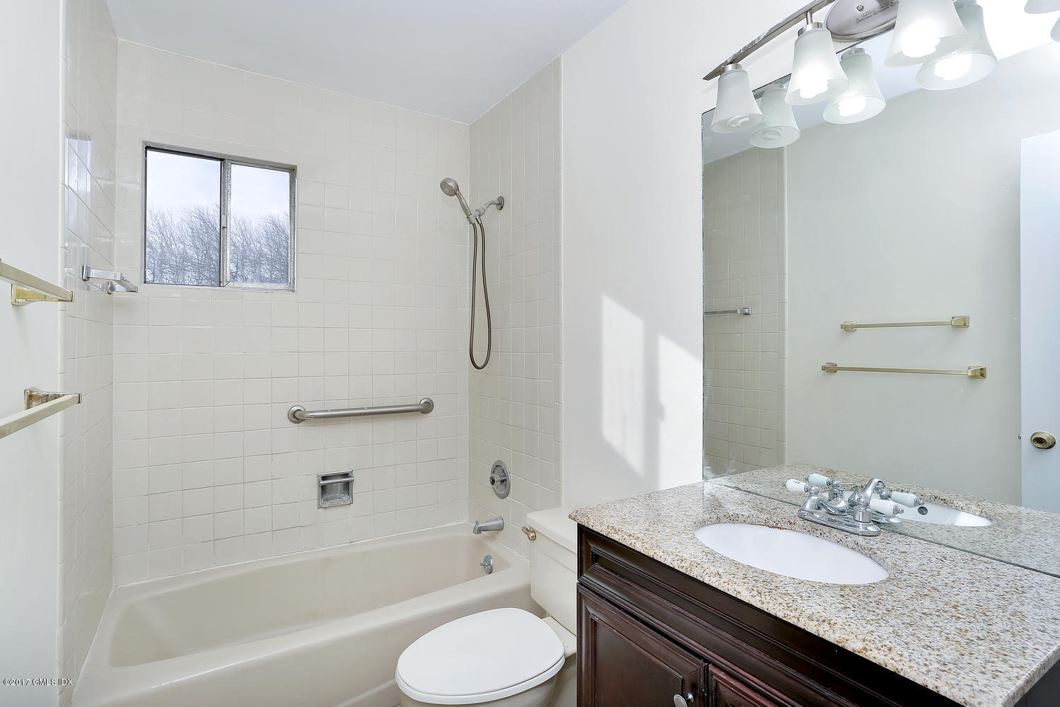 6 Amherst Road Riverside, CT 06878 - Photo 16 of 22 a bathroom with a granite countertop sink toilet mirror and bathtub