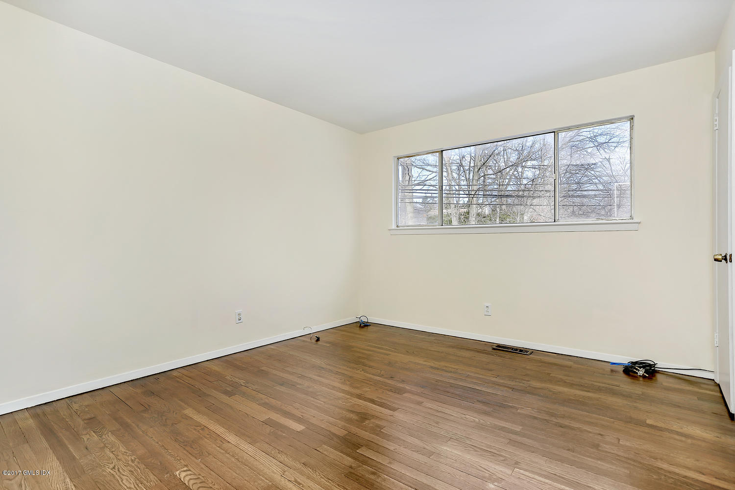 6 Amherst Road Riverside, CT 06878 - Photo 18 of 22 an empty room with wooden floor and windows
