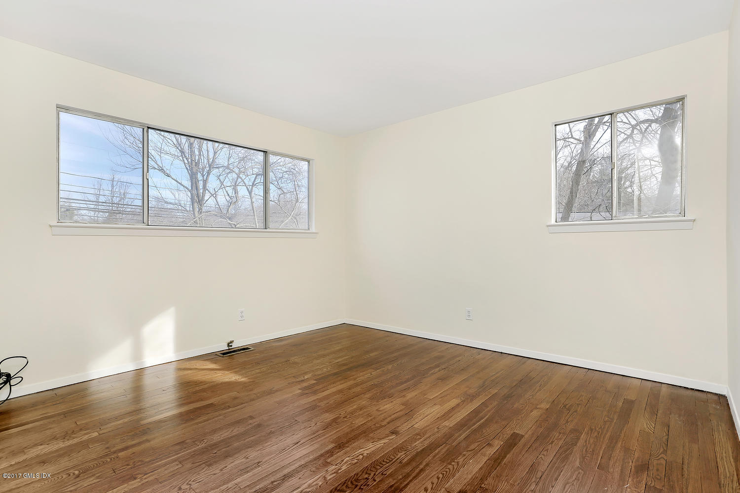 6 Amherst Road Riverside, CT 06878 - Photo 19 of 22 a view of empty room with wooden floor and fan